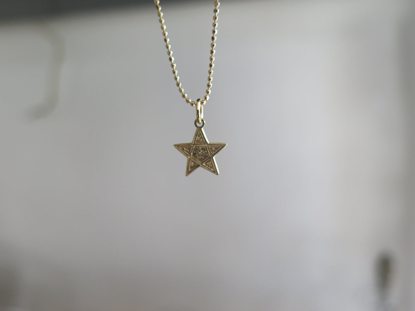 Colgante Estrella grabada